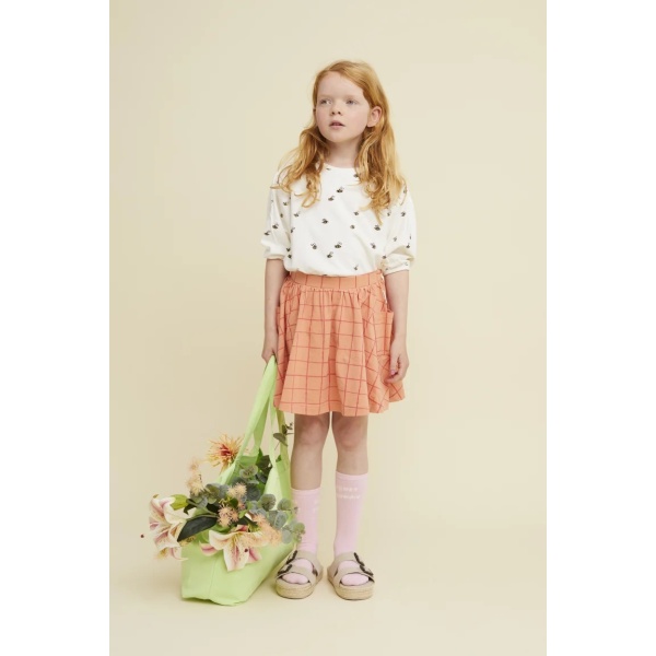 FALDA CON BOLSILLOS Y ESTAMPADO A CUADROS